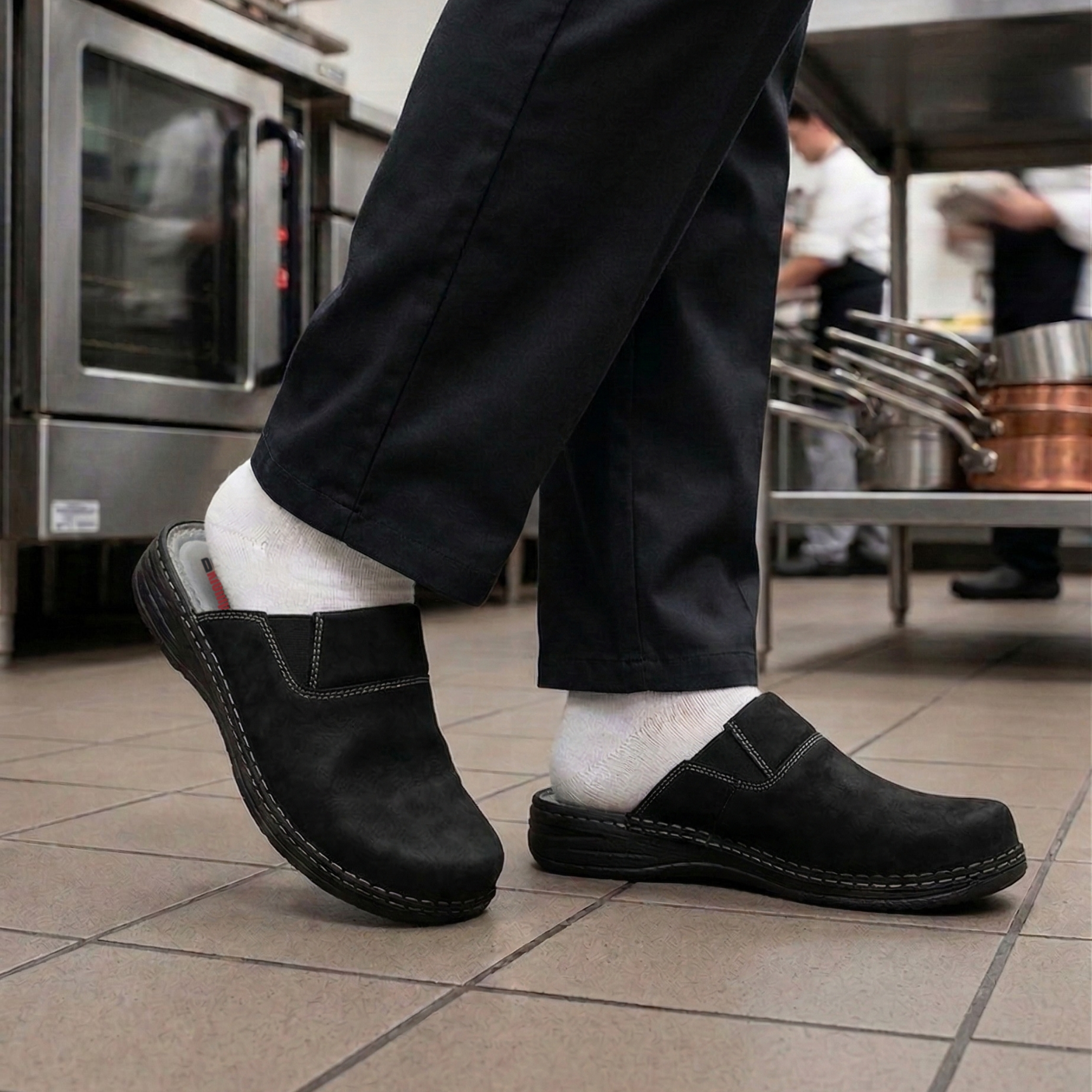 Person wearing comfortable black sabo slippers working in a kitchen